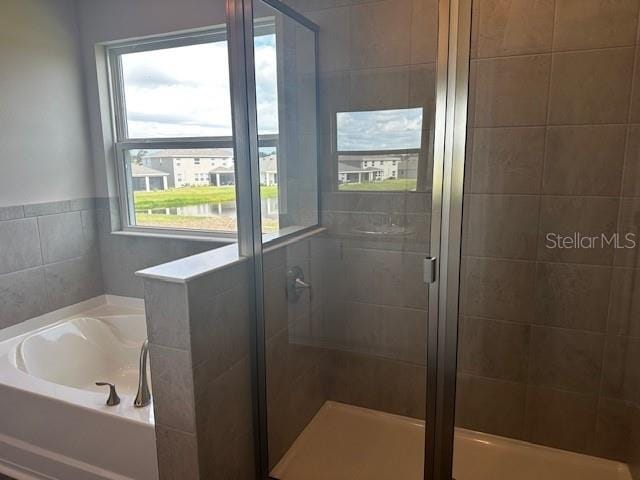 16025 7th Ave E, Bradenton, FL 34212 - bathroom with a bath and a stall shower