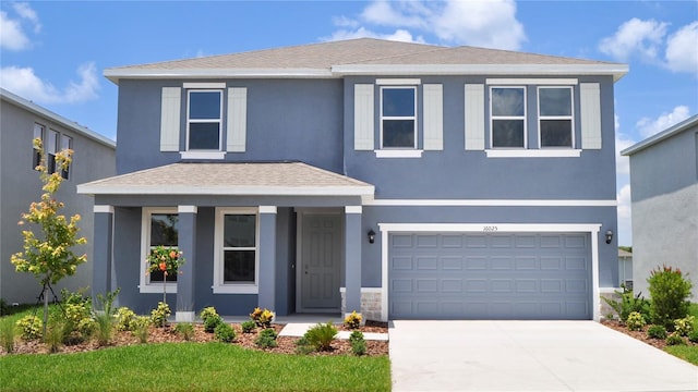 16025 7th Ave E, Bradenton, FL 34212 - traditional home with a garage, covered porch, concrete driveway, stucco siding, and roof with shingles