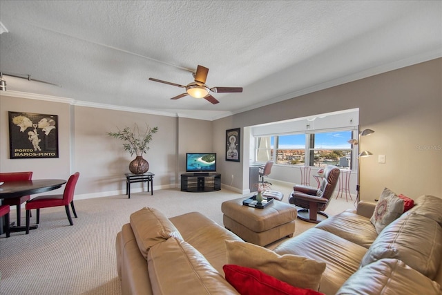 carpeted living room with ceiling fan, ornamental molding, and a textured ceiling