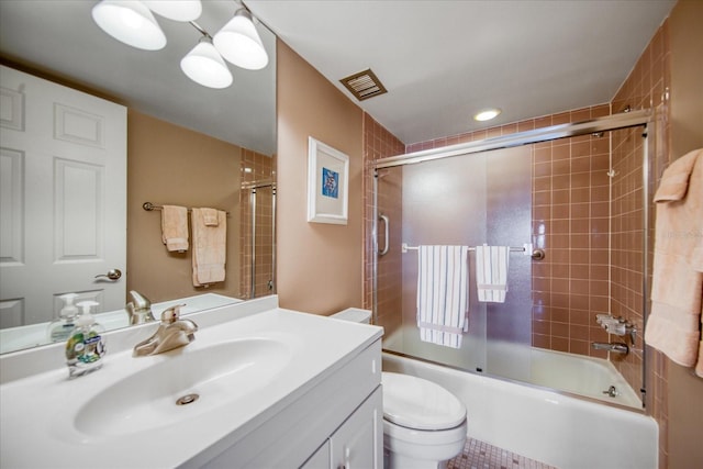 full bathroom with vanity, toilet, and enclosed tub / shower combo