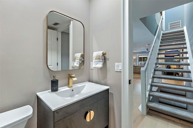 bathroom with vanity and toilet