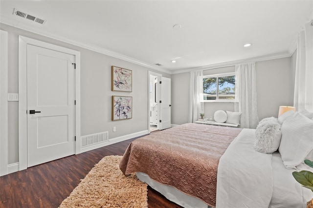 bedroom featuring dark hardwood / wood-style floors and crown molding