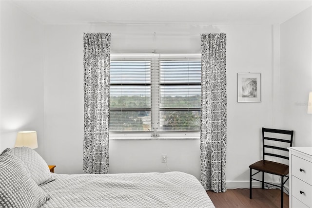 bedroom with wood-type flooring