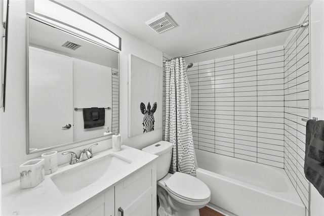 full bathroom with vanity, toilet, and shower / bath combo