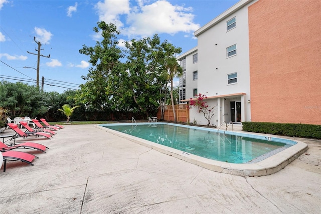 view of pool featuring a patio area