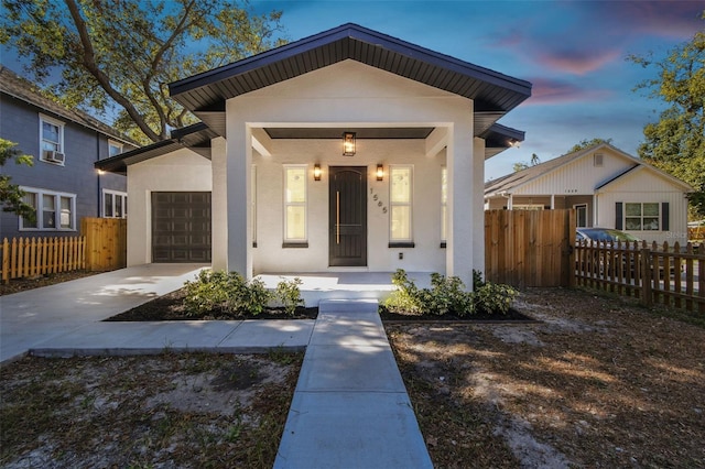 view of front of house with a garage and a porch