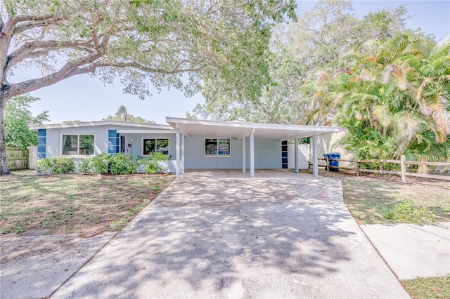 single story home featuring a carport