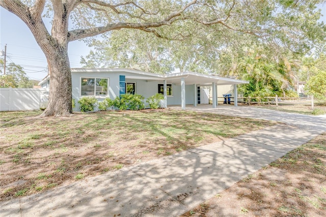 ranch-style home with a carport