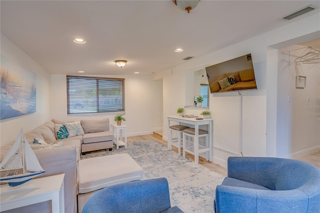 living room with light hardwood / wood-style floors