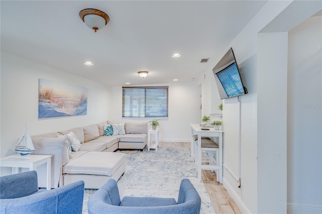 living room with light hardwood / wood-style flooring