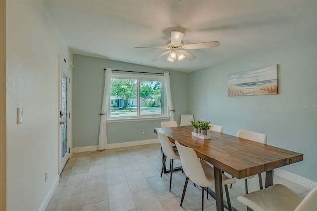 dining room with ceiling fan and light tile patterned flooring