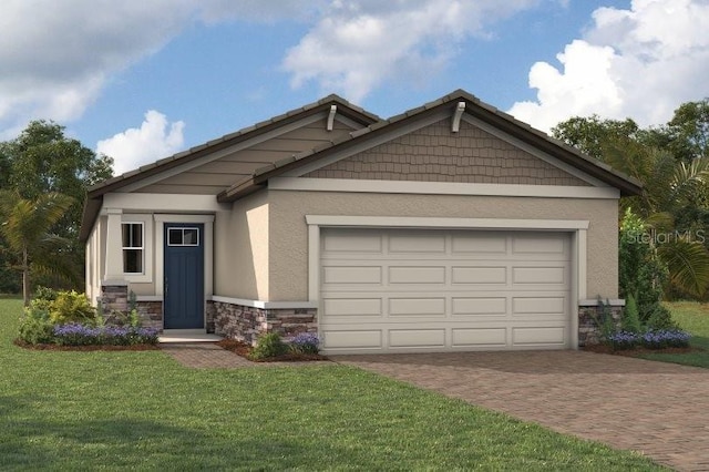 view of front of home featuring a front lawn and a garage