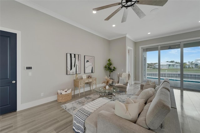 5713 Tybee Island Dr, Apollo Beach, FL 33572 - living area featuring a ceiling fan, recessed lighting, baseboards, and ornamental molding