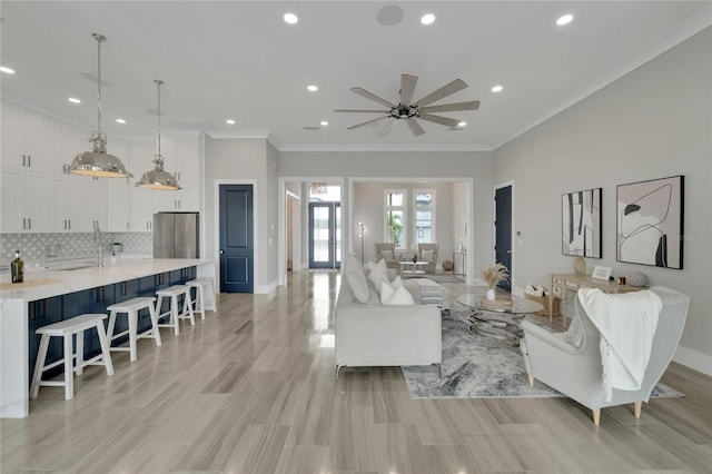 5713 Tybee Island Dr, Apollo Beach, FL 33572 - living room with ornamental molding, a ceiling fan, baseboards, and recessed lighting