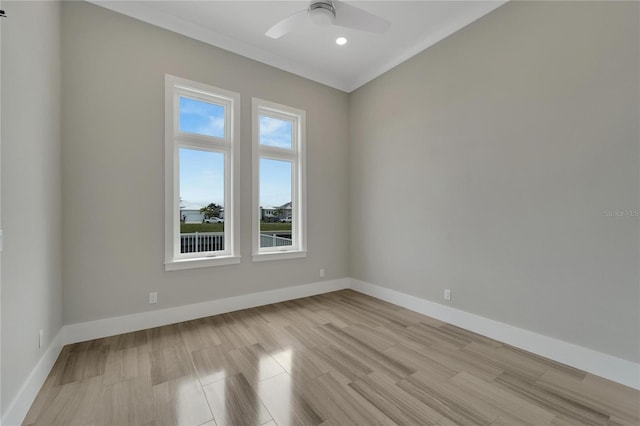 empty room with light hardwood / wood-style floors, ceiling fan, and a healthy amount of sunlight