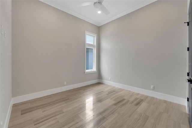 empty room featuring ceiling fan, light wood-type flooring, and crown molding