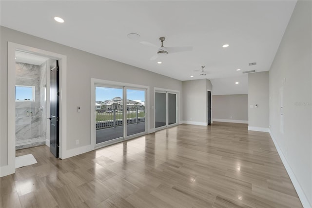 unfurnished room with ceiling fan and light hardwood / wood-style flooring