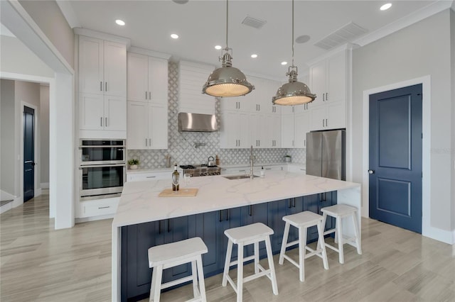 5713 Tybee Island Dr, Apollo Beach, FL 33572 - kitchen featuring a sink, wall chimney range hood, white cabinetry, backsplash, and recessed lighting