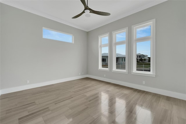 5713 Tybee Island Dr, Apollo Beach, FL 33572 - empty room featuring a ceiling fan, baseboards, and crown molding