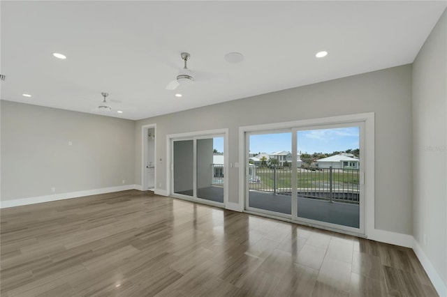 5713 Tybee Island Dr, Apollo Beach, FL 33572 - unfurnished room featuring ceiling fan, baseboards, wood finished floors, and recessed lighting