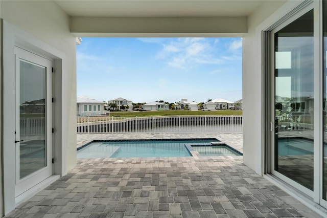 5713 Tybee Island Dr, Apollo Beach, FL 33572 - view of pool featuring a fenced backyard, a pool with connected hot tub, a residential view, a patio, and a water view