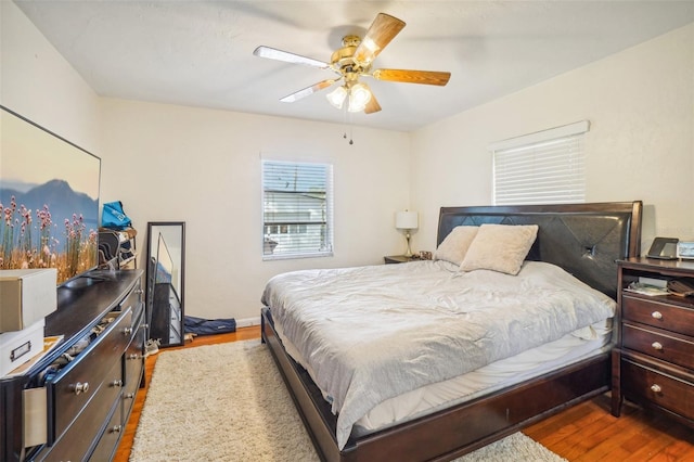 bedroom featuring wood-type flooring and ceiling fan