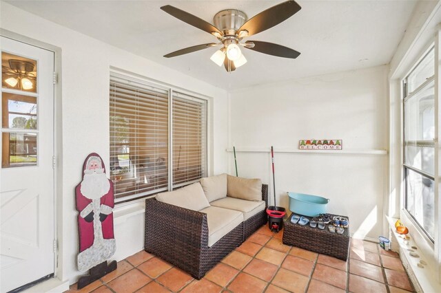 interior space with ceiling fan and tile patterned flooring