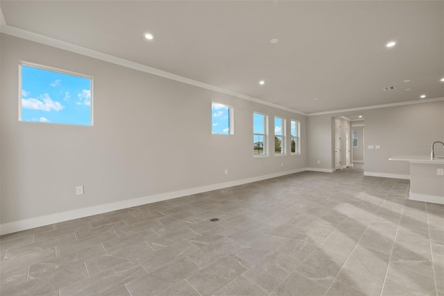 empty room featuring ornamental molding