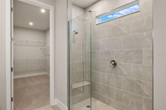 bathroom with a tile shower