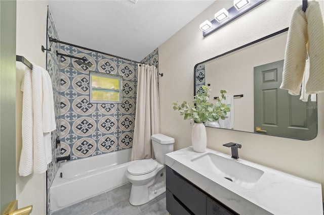 full bathroom featuring tile patterned flooring, shower / bath combo with shower curtain, vanity, and toilet