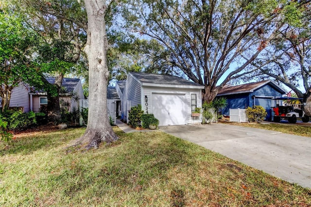 ranch-style house with an outbuilding, a garage, and a front yard