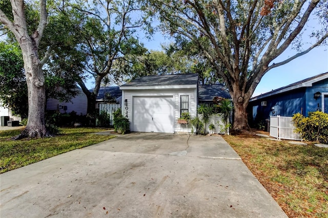 garage featuring a lawn