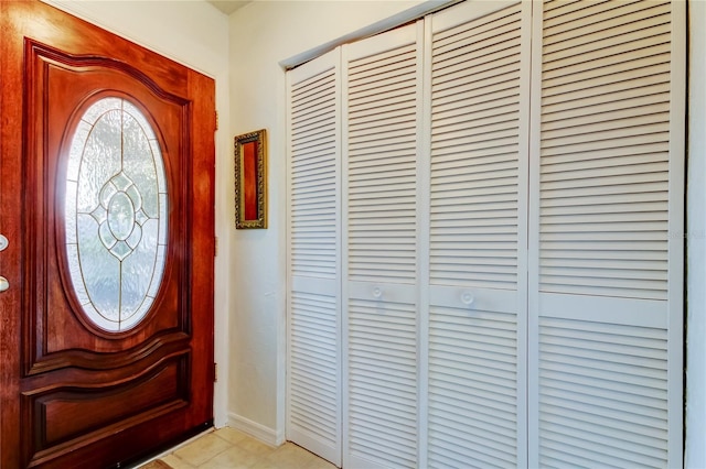 foyer entrance featuring light tile patterned floors