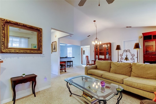 living room featuring light carpet, plenty of natural light, ceiling fan with notable chandelier, and lofted ceiling