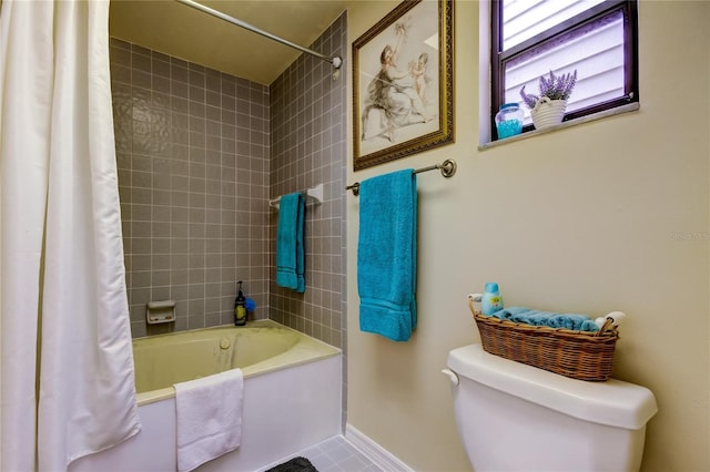 bathroom featuring tile patterned flooring, shower / bathtub combination with curtain, and toilet