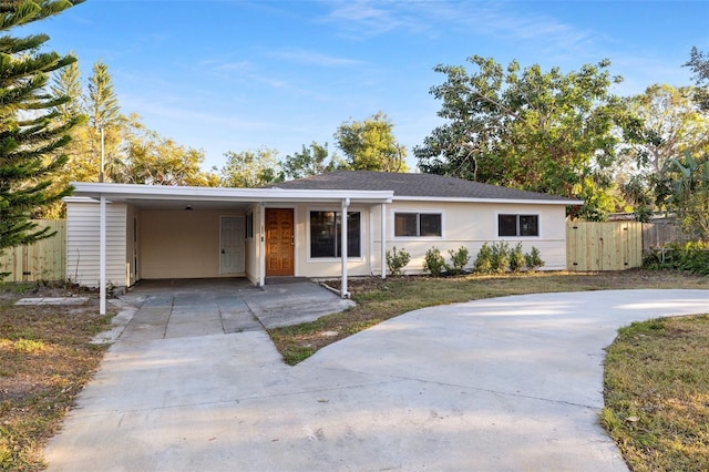 ranch-style house with a carport