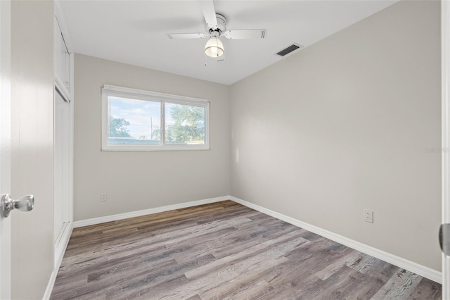 unfurnished room featuring ceiling fan and light hardwood / wood-style floors