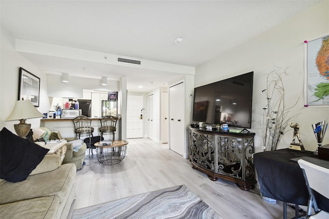 36750 US Highway 19 N Unit 01104, Palm Harbor, FL 34684 - living room with light wood-type flooring