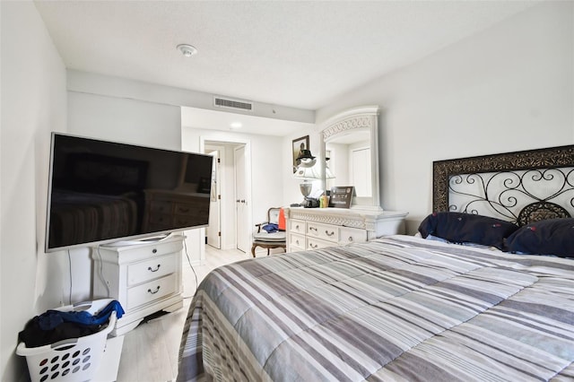 bedroom with light hardwood / wood-style flooring