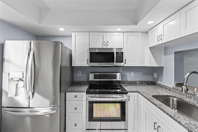 3034 Eastland Blvd Unit D108, Clearwater, FL 33761 - kitchen featuring stainless steel appliances, recessed lighting, white cabinetry, and stone countertops