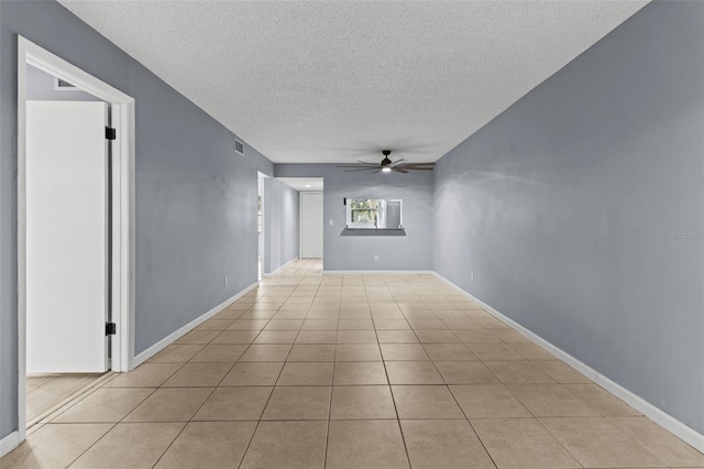 3034 Eastland Blvd Unit D108, Clearwater, FL 33761 - empty room featuring a textured ceiling, a ceiling fan, and light tile patterned floors