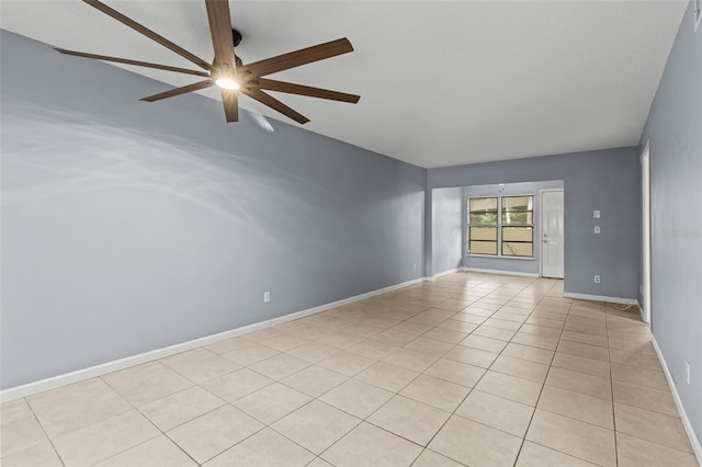 spare room with light tile patterned floors and ceiling fan