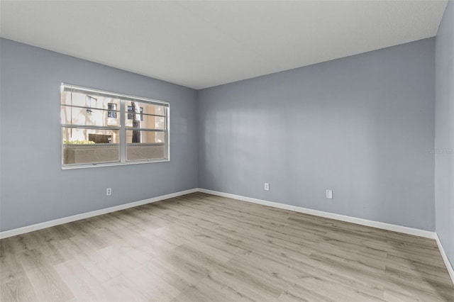 spare room with light wood-type flooring