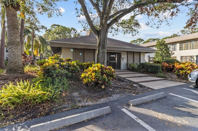 3034 Eastland Blvd Unit D108, Clearwater, FL 33761 - view of front of house with uncovered parking and stucco siding
