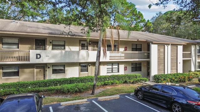 3034 Eastland Blvd Unit D108, Clearwater, FL 33761 - view of property featuring uncovered parking