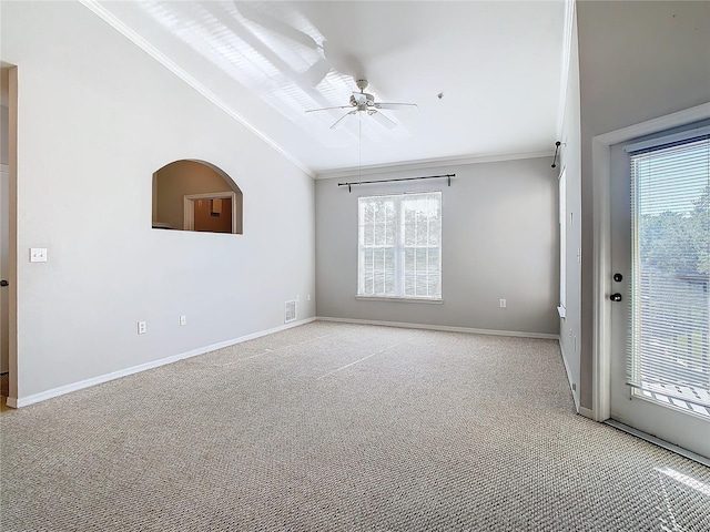 spare room featuring light carpet, crown molding, ceiling fan, and lofted ceiling