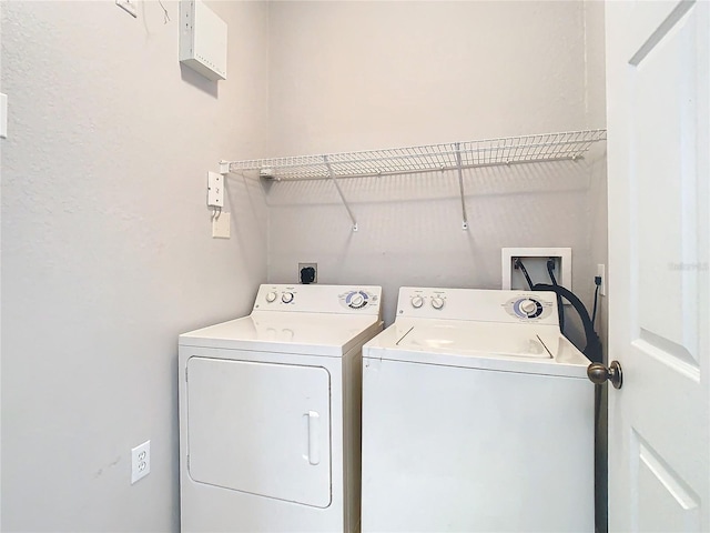 laundry area with independent washer and dryer