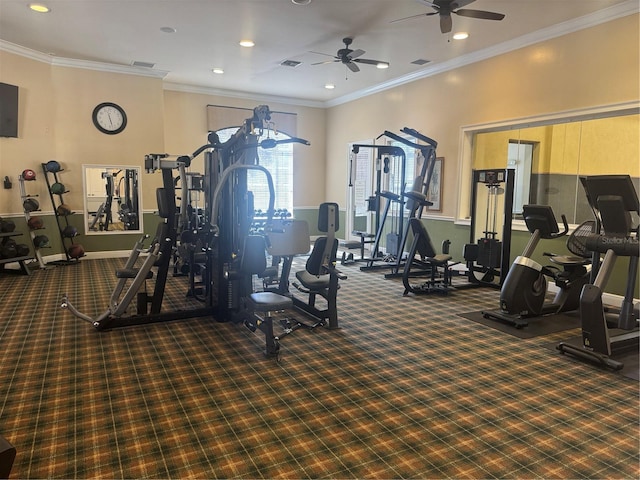 exercise room with dark colored carpet, ceiling fan, and ornamental molding