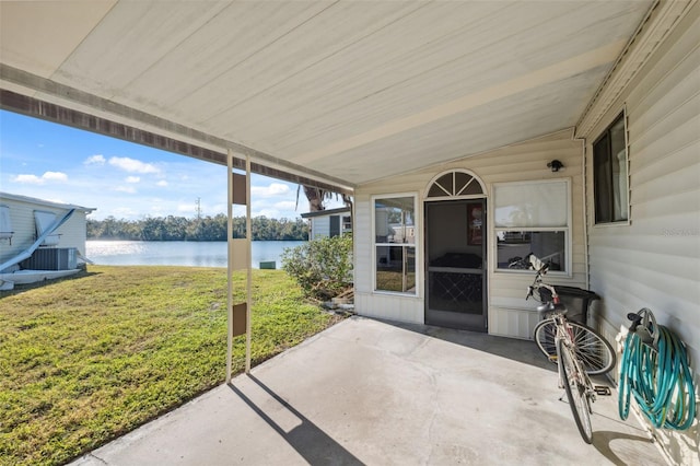 view of patio featuring central AC unit and a water view