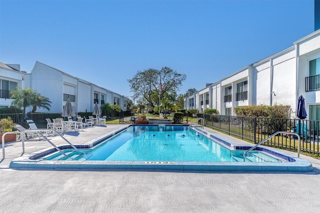 view of swimming pool with a patio